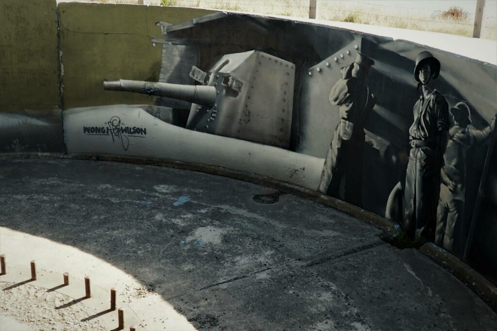 Mural of the gun placement at Godley Head