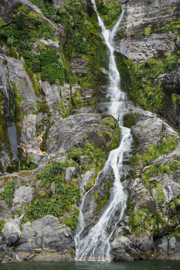 Steep natural waterfall/Milford Sound/Fiordland National Park